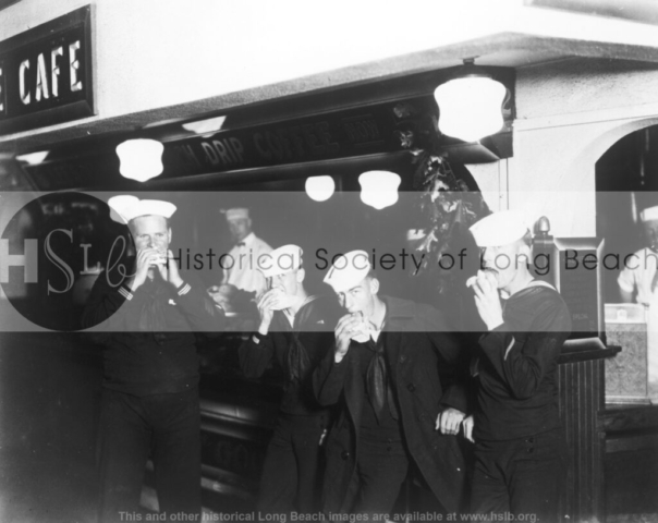 Sailors eating burgers, c. 1937