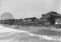 California beachfront people relaxing on the shoreline vintage