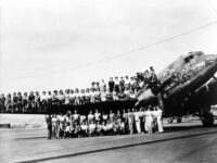 Douglas crew sitting on plane wing