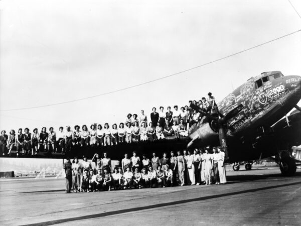 Douglas crew sitting on plane wing