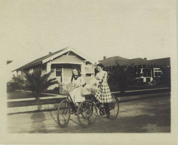 Kids riding on bikes in neighborhood