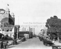 historical society street with parked cars vintage photograph