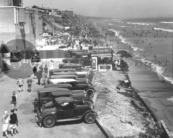 Long beach cars parked in front of the beach photo