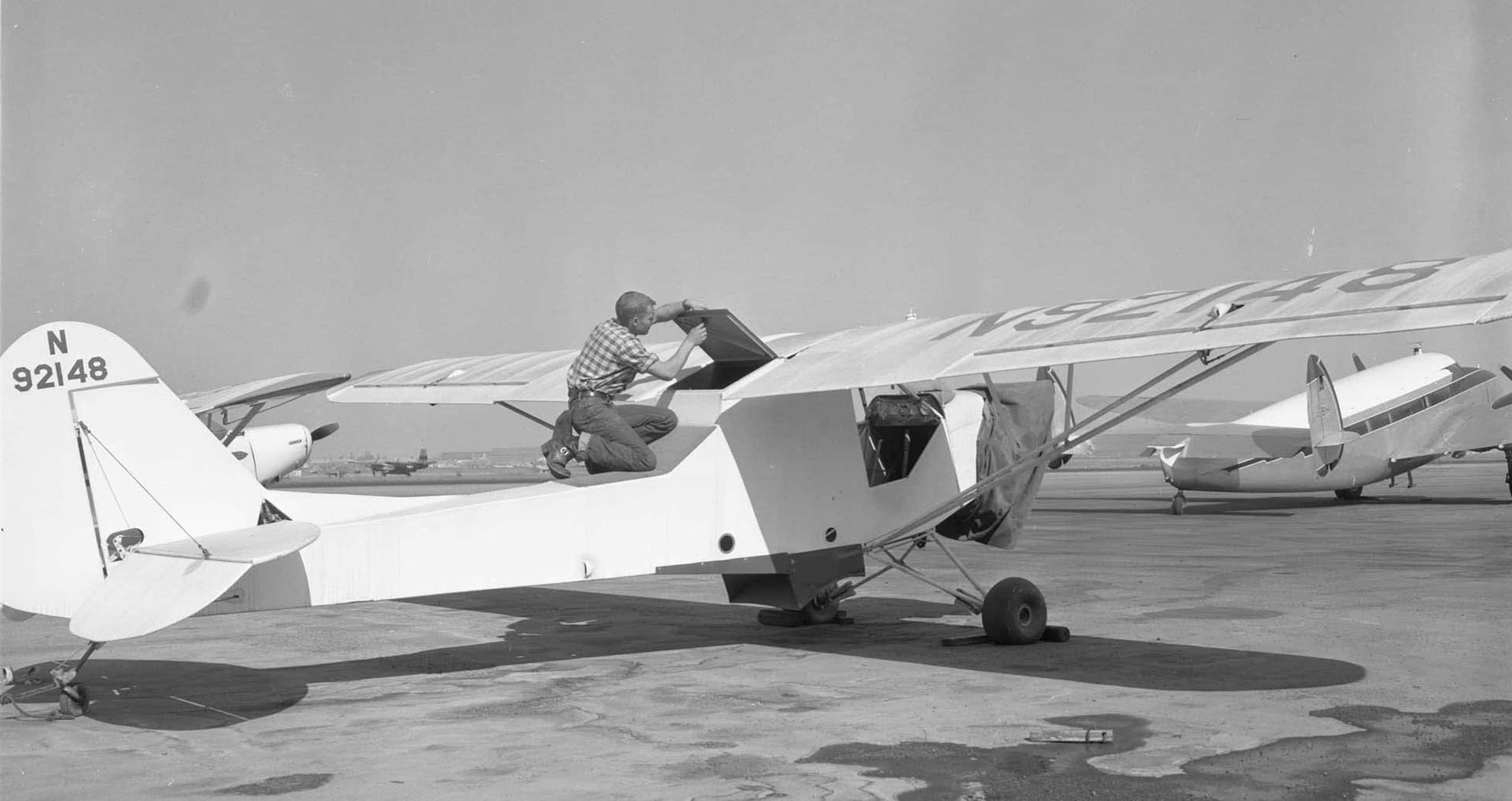 Man working on airplane long beach airport
