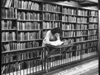 Woman in the library reading vintage long beach