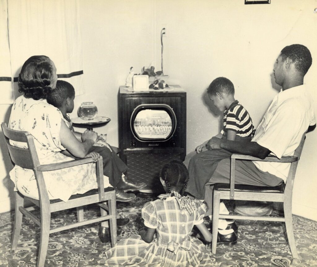 Vintage family watching tv in Livingroom